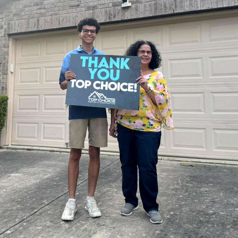 Satisfied homeowners with Top Choice Roofing