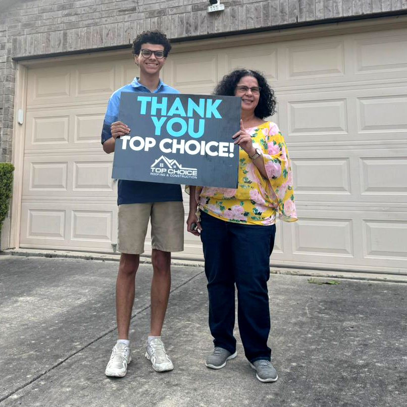 Satisfied homeowners with Top Choice Roofing